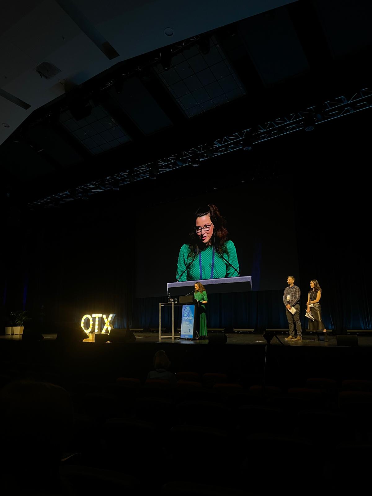 Kat speaking at the National OTX Conference 2024