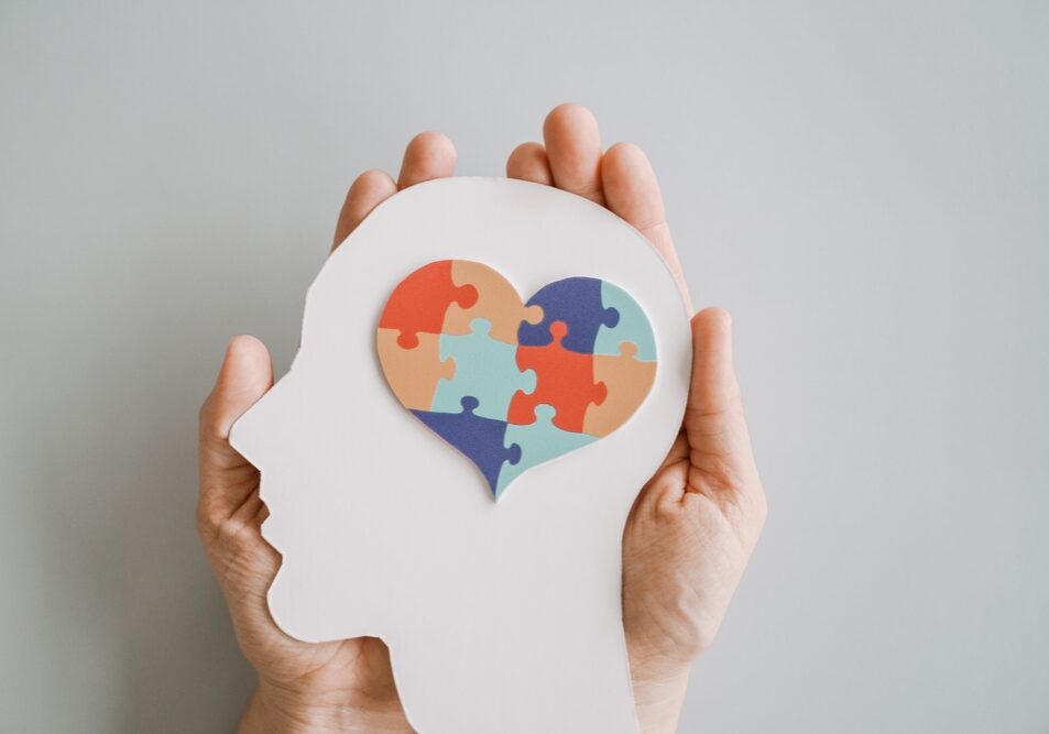 Hands,Holding,Jigsaw,Puzzle,Heart,Shape,In,Brain,Autism,Awareness,