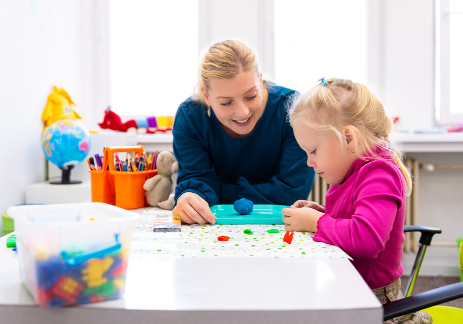 Toddler,Girl,In,Child,Occupational,Therapy,Session,Doing,Sensory,Playful